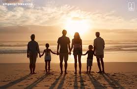 a family standig at beach side